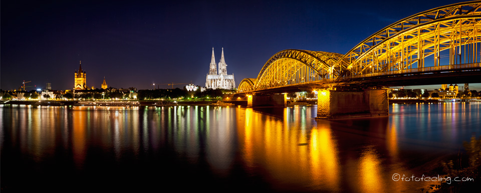 Hohenzollernbrücke über dem Rhein, Kölner Dom, Musical Dome, Alte Bahndirektion, St. Kunibert (romanische Basilika), Köln